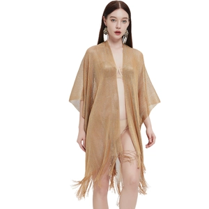 Sheer gold metallic knit cardigan with long fringe tassels for beach vacation