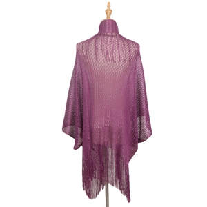 Detailed close-up of purple hollow knit shawl with elegant mesh pattern and long fringes