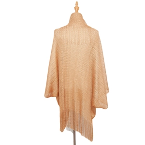 Detail of gold hollow knit shawl featuring bohemian tassels and metallic texture finish