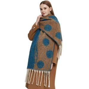 Thick chunky knit scarf with retro polka dots and long tassels in brown and blue
