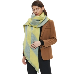 Elegant oversized plaid tassel shawl in vibrant yellow and blue geometric knit patterns