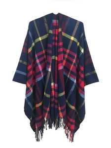 Detail of classic plaid pattern with fringe on the hem of a soft navy blue women's shawl