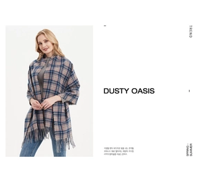 Detailed view of thick winter plaid scarf with fringe tassels in blue and grey patterns