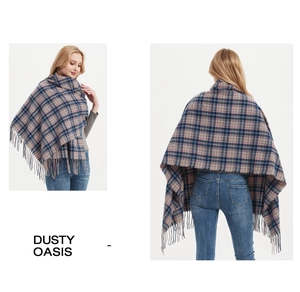 Detail of blue and pink plaid shawl with thick texture and long decorative fringes
