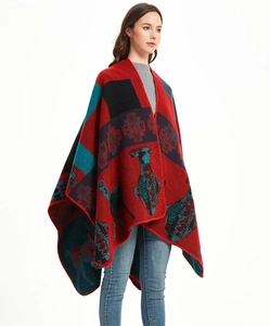 Detail of red knit shawl featuring vintage jacquard reindeer and geometric patterns
