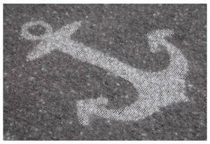 Macro shot of gray boucle fabric scarf with white anchor patterns and thick fiber texture