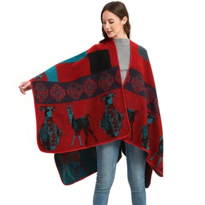 Red Christmas shawl with reindeer pattern and folk geometric motifs in thick knit style