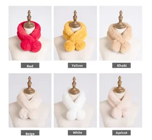 Detail view of plush faux fur scarves with pom-pom accents in six various colors
