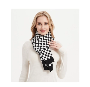 Detailed close-up of a women's black and white checkerboard knit scarf with ribbed edge