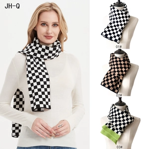 Detailed comparison of knitted checkered scarves in black, white, and brown color options