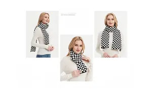 Detailed knit texture of a black and white checkerboard pattern scarf on a white sweater