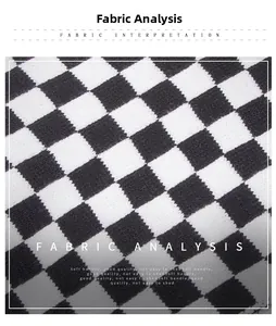 Macro detail of soft black and white checkerboard knit fabric with premium texture