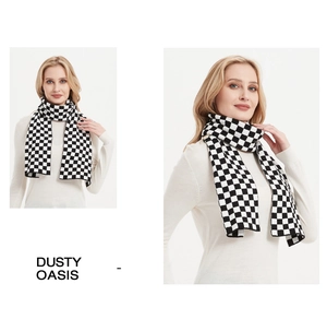 Detail of checkered knit scarf in black and white with vintage aesthetic and soft texture