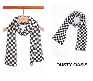 Detail of knit scarf showing black and white checkerboard pattern and quality stitching