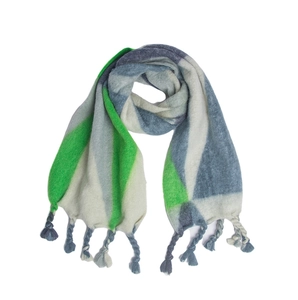 Detailed view of color block knit scarf with green and grey geometric patterns and long tassels