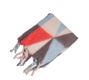 Detail of geometric color-block scarf with thick braided long tassels and soft texture