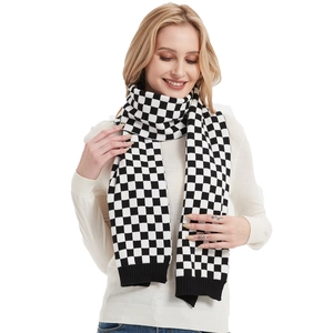 Classic black and white checkerboard knit scarf with thick ribbed ends for winter warmth