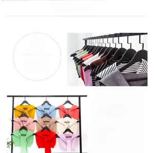 Detail showing 15 colors of knit faux collar shawls in a minimalist solid design