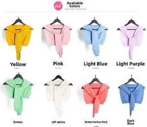 Collection of knitted collar shawls in eight vibrant colors displayed on hangers