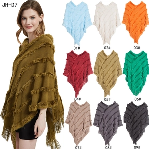 Women's V-neck knit poncho with faux fur trim and tassels in multiple colors