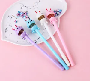 Close-up of four cute rabbit shaking head gel pens with springs in pastel colors