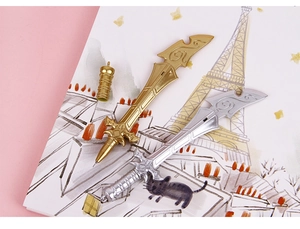 Detail of creative sword-shaped gel pens with intricate spiral textures in gold and silver