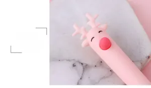 Detail shot of a pink cartoon deer gel pen with cute antlers and red push button