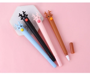 Close-up of four colorful cartoon reindeer pens with fine tips on a pink background