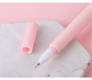 Close-up of pink reindeer gel pen needle tip on a marble base with matte finish