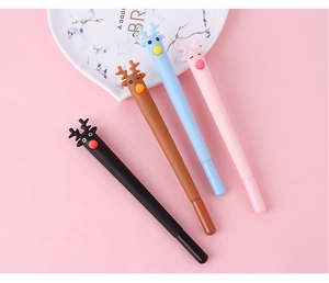 Close-up of four colorful cartoon reindeer pens on a soft pink background with ceramic decor