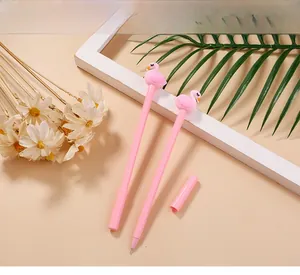 Close-up of pink flamingo gel pens with fine tips on a decorative floral background
