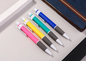 Set of four retractable ballpoint pens in pastel colors with non-slip textured grips