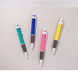 Set of four colorful retractable ballpoint pens with grey non-slip rubber grips
