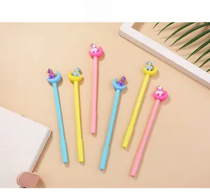 Detailed close-up of cute cartoon unicorn moon pens in pink, blue, and yellow colors