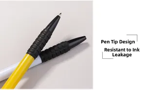 Macro detail of ballpoint pen tip with non-slip textured rubber grip and fine metal nib