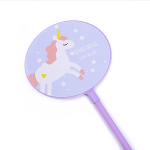Close-up of a light purple unicorn fan pen with UNICORNS are real printed on it