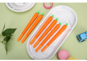 Set of six cute carrot-shaped gel pens in a white ceramic dish for stationery lovers