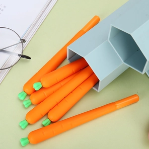 Creative orange carrot shaped gel pens for students with green leaf cap in light blue holder