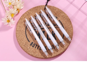 Detailed view of 5 white retractable gel pens with soft grips on a cork mat background