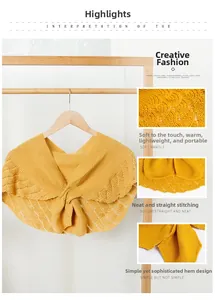 Detail of yellow hollow knit shawl showing soft texture and decorative crossover knot