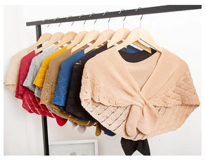 Detailed knit texture and tie-up ribbon closure of diverse colorful hollow shawls