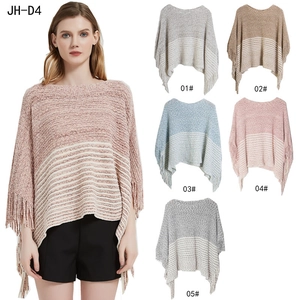Striped knit poncho with tassels in various colors like pink, grey, and camel
