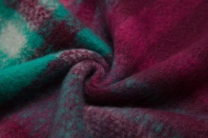 Macro shot of purple and teal plaid faux mohair scarf showing soft brushed fiber texture