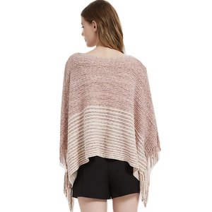 Women's pink knit poncho with white stripes and fringe trim, back view casual style