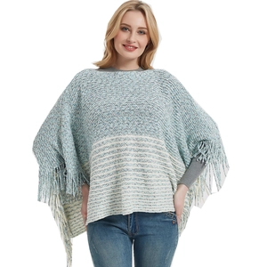 Women's light blue knit poncho with stylish striped tweed pattern and elegant fringe trim