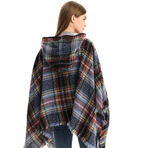 Women's hooded plaid poncho with tassels in blue and red checkered pattern, back view