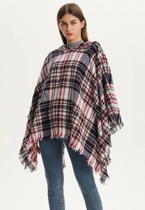 Close-up of a women's plaid hooded poncho featuring soft fringe edges and a classic pattern