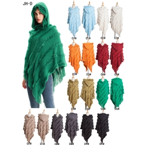Knitted hooded poncho with long fringe and faux fur trim in nine versatile solid colors