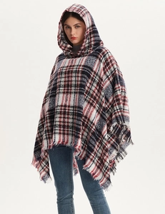 Detailed close-up of hooded plaid shawl with red and white patterns and fringed edges