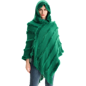 Dark green hooded knit poncho for women with thick faux fur trim and tassel details
